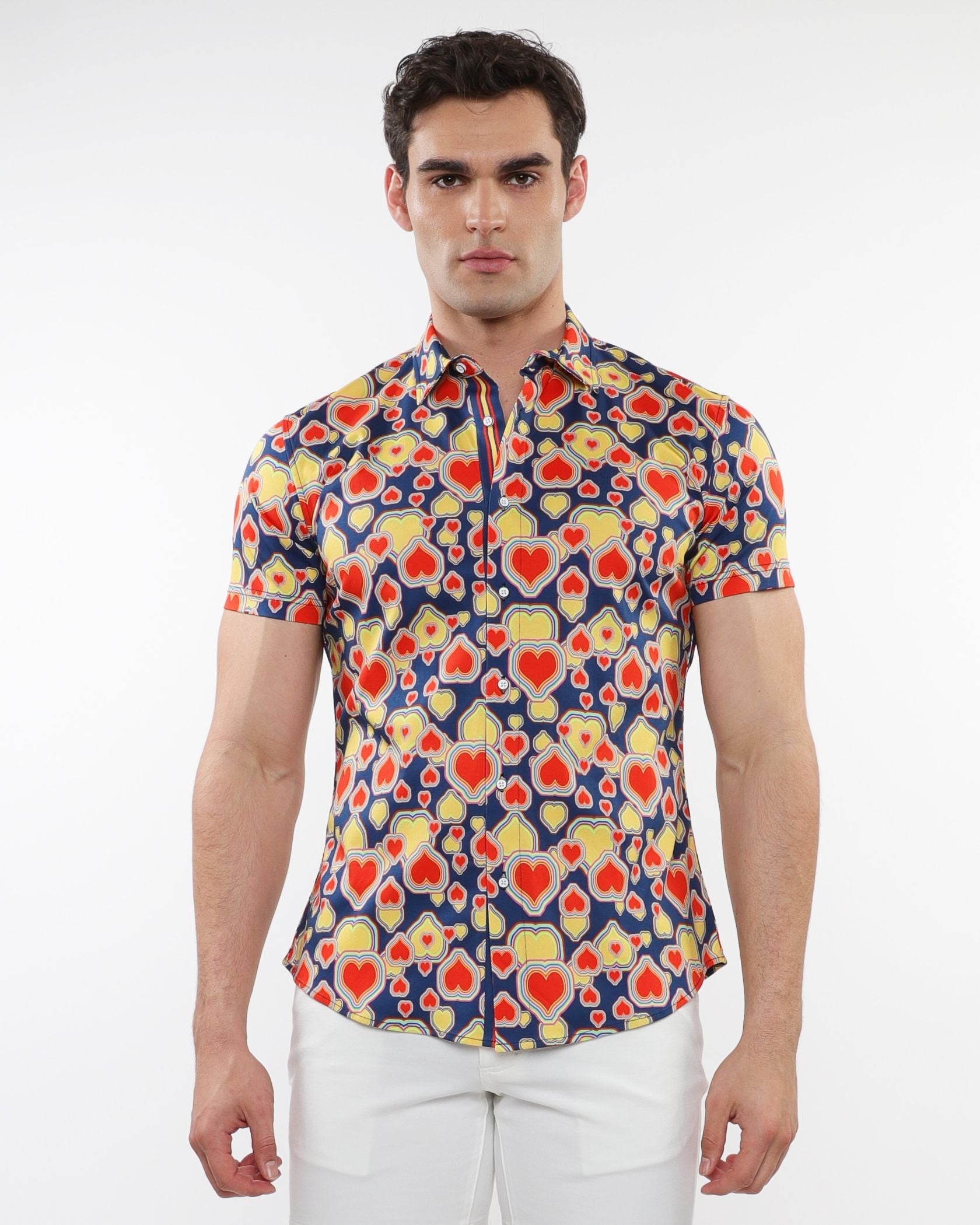 A vibrant hearts print stretch knit short-sleeved shirt with red and yellow hearts on navy blue background