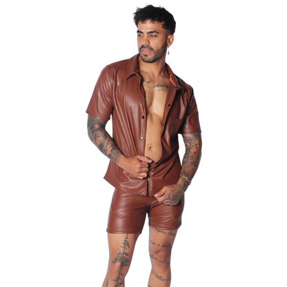 Brown short-sleeve button-down shirt in smooth faux leather with a classic collar and chest pocket.