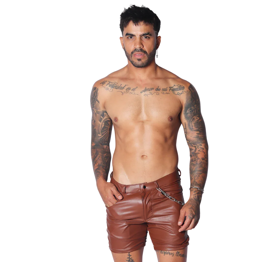 Brown faux leather shorts with a slim fit, belt loops, and a decorative silver chain detail at the hip.
