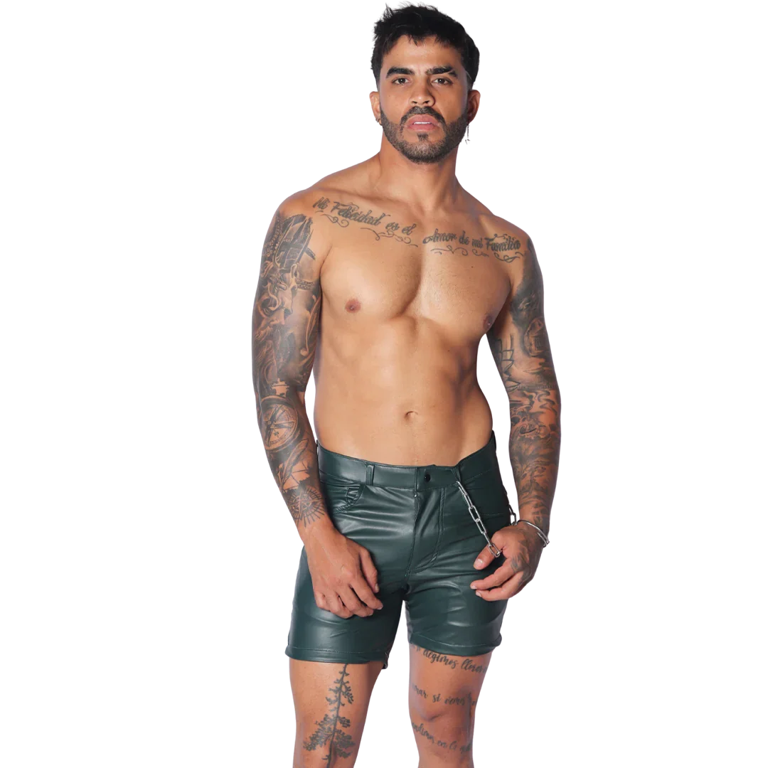Men's dark green faux leather fitted shorts with a zipper closure and a silver chain accessory at the waist.