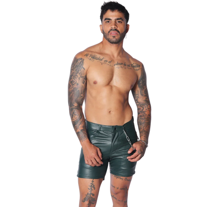 Men's dark green faux leather fitted shorts with a zipper closure and a silver chain accessory at the waist.