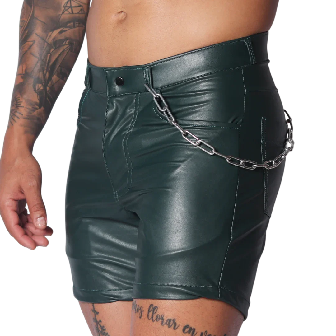Dark green faux leather fitted shorts with a silver chain accessory attached to the waistband.