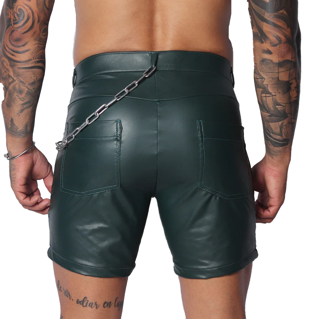 Dark green faux leather shorts with back pockets and a silver chain accessory attached to the waistband.