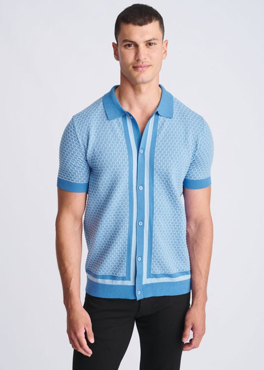 Light blue short-sleeved honeycomb textured knit polo shirt with darker blue trim on collar placket cuffs and hem