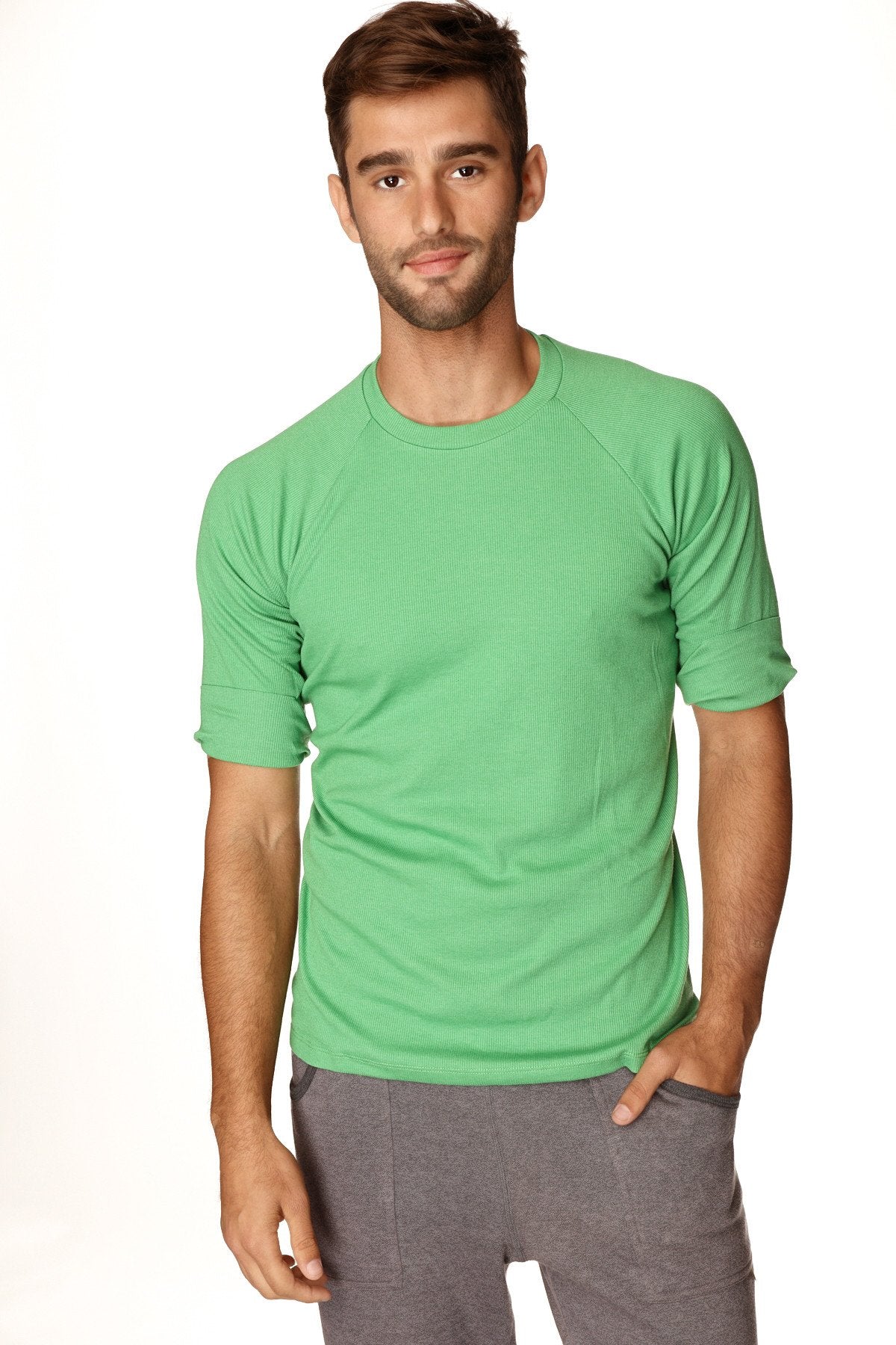 A men’s short-sleeved green athletic Hybrid crew neck raglan tee with ribbed texture rolled-up sleeves in bamboo green