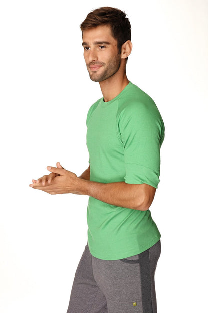 A vibrant bamboo green hybrid crew neck raglan tee made of soft cotton fabric with short sleeves