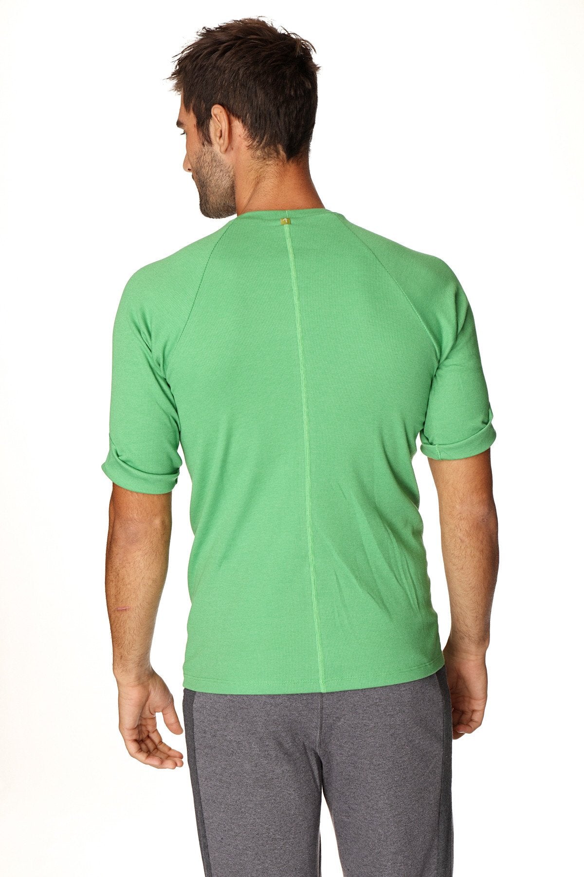 A vibrant green hybrid crew neck raglan tee with short sleeves ribbed texture and rolled cuffs made from bamboo fiber