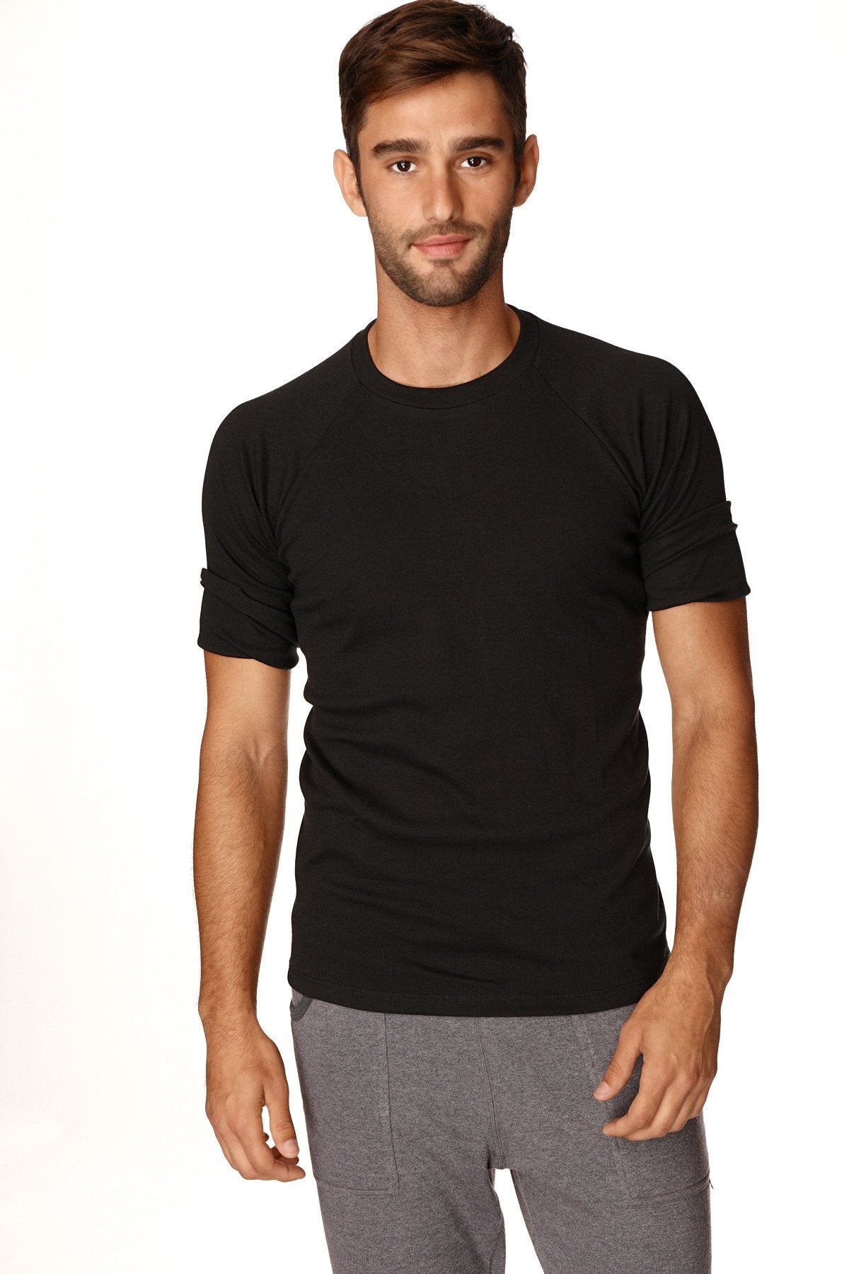 Black short-sleeved hybrid crew neck raglan tee with rolled-up sleeves made of breathable fabric for casual wear