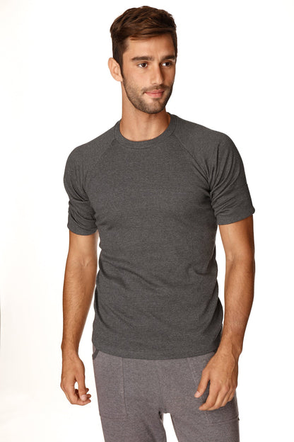 A dark heather gray short-sleeved hybrid crew neck raglan tee featuring comfortable lightweight fabric