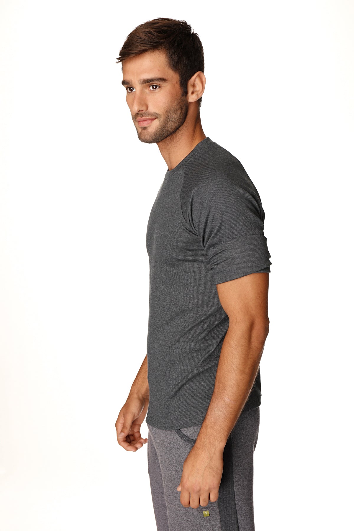 Dark gray heathered short-sleeved hybrid crew neck raglan tee made of soft breathable fabric in charcoal color