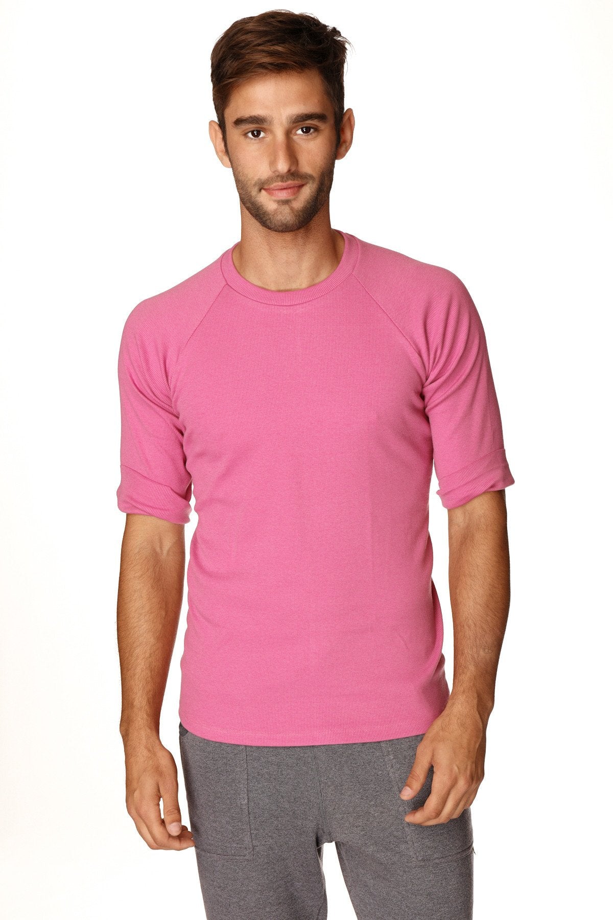 A vibrant pink short-sleeved hybrid crew neck raglan tee with a round neckline perfect for casual wear