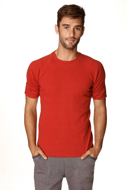 Red crewneck raglan tee with short sleeves and ribbed cuffs made from breathable hybrid fabric