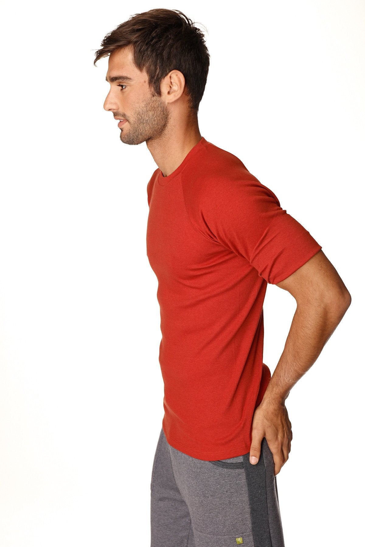 Red short-sleeved hybrid crew neck raglan tee in cinnabar red with subtle texture for athletic use