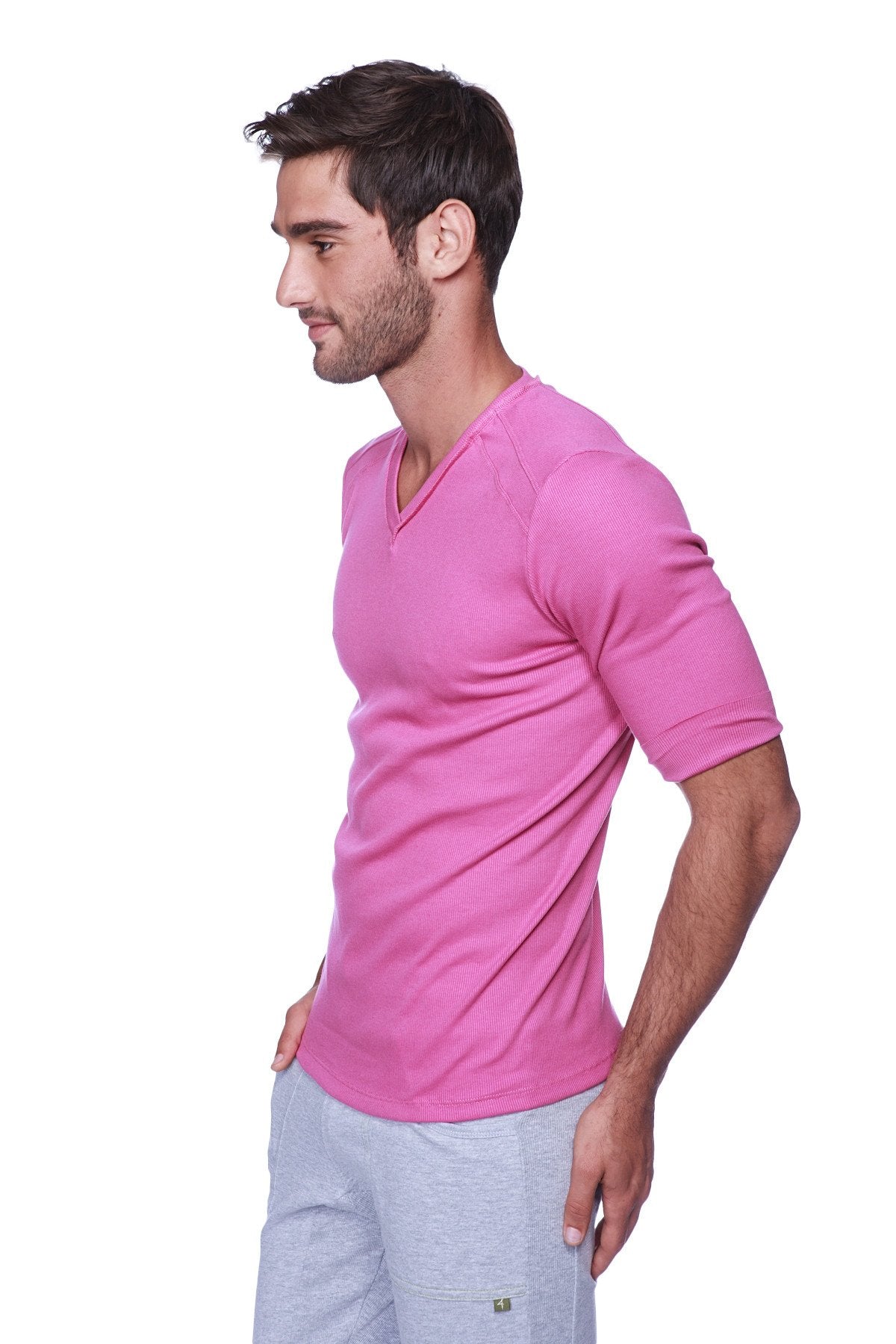 A vibrant pink hybrid v neck t shirt made of soft stretchy fabric with short sleeves for comfortable wear