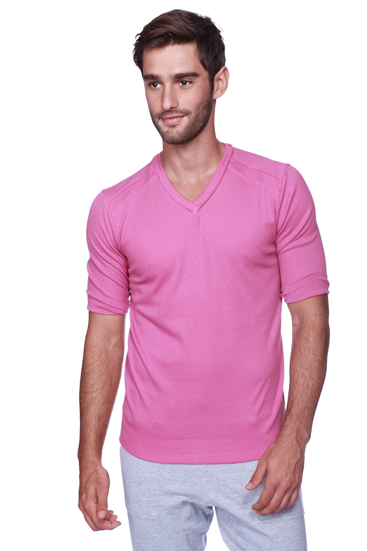 A vibrant pink hybrid v-neck short-sleeved shirt made of smooth lightweight fabric perfect for casual wear
