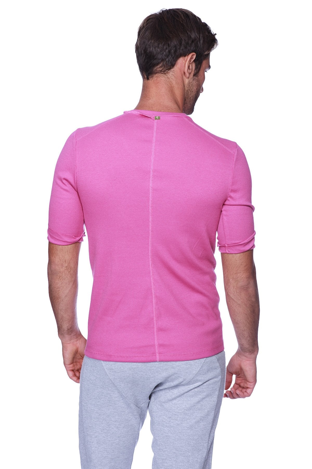 Vibrant pink hybrid v-neck athletic shirt in ribbed fabric shown from the back with subtle vertical seam