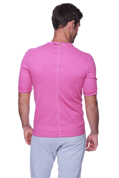 Vibrant pink hybrid v-neck athletic shirt in ribbed fabric shown from the back with subtle vertical seam