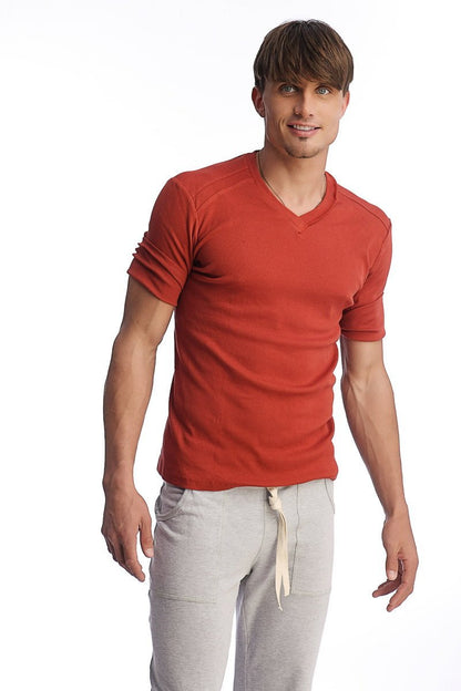 Men’s cinnabar red hybrid v-neck short-sleeve t-shirt with textured fabric and rolled-up sleeves