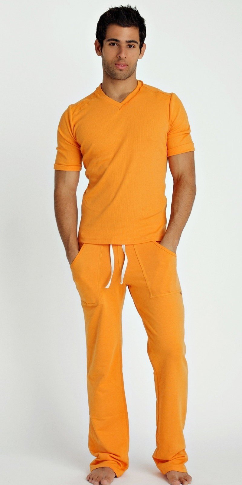 Orange short-sleeved hybrid v-neck t-shirt with matching pants and white drawstrings in sun orange color
