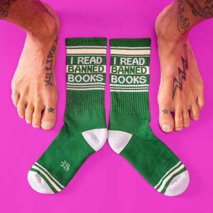 Green crew socks with white accents and bold black i read banned books text featuring ribbed texture and reinforced toes
