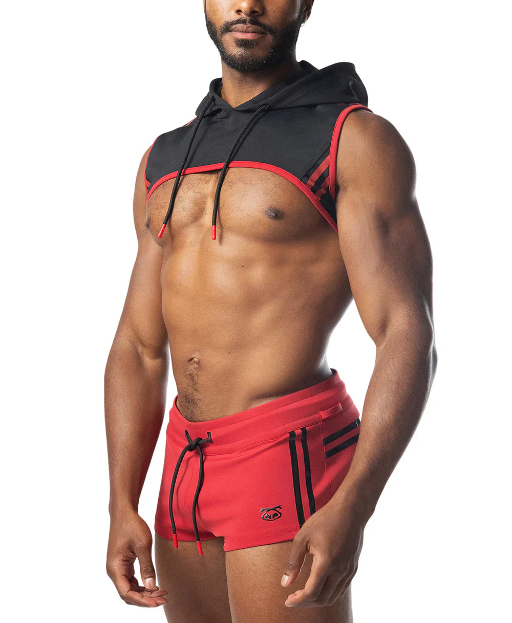Ignite cropped hoodie black and red sleeveless hoodie with drawstring hood worn over muscular torso