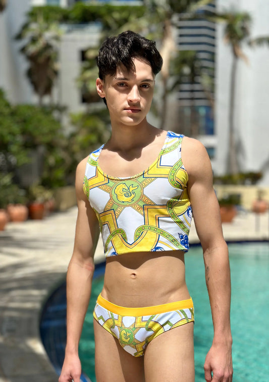 Men's crop tank top in white with colorful geometric patterns paired with matching briefs by Maris Equi.