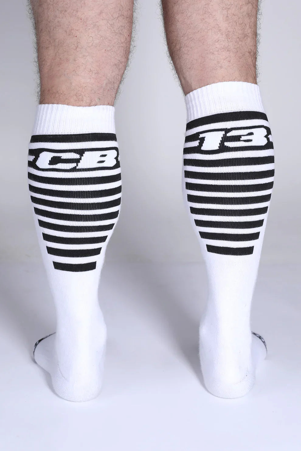 Iron grip knee high socks in white with black horizontal stripes and bold cb or 13 lettering on the upper leg