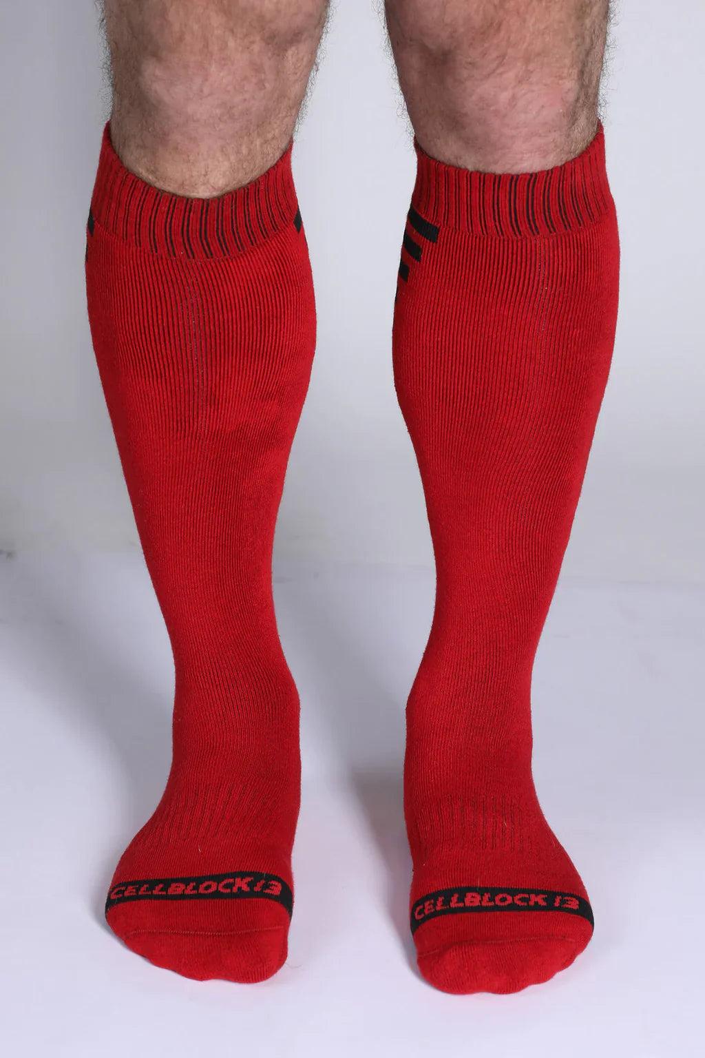 Iron grip knee high socks in red with black ribbed cuffs and toe bands featuring the cellblock 13 logo