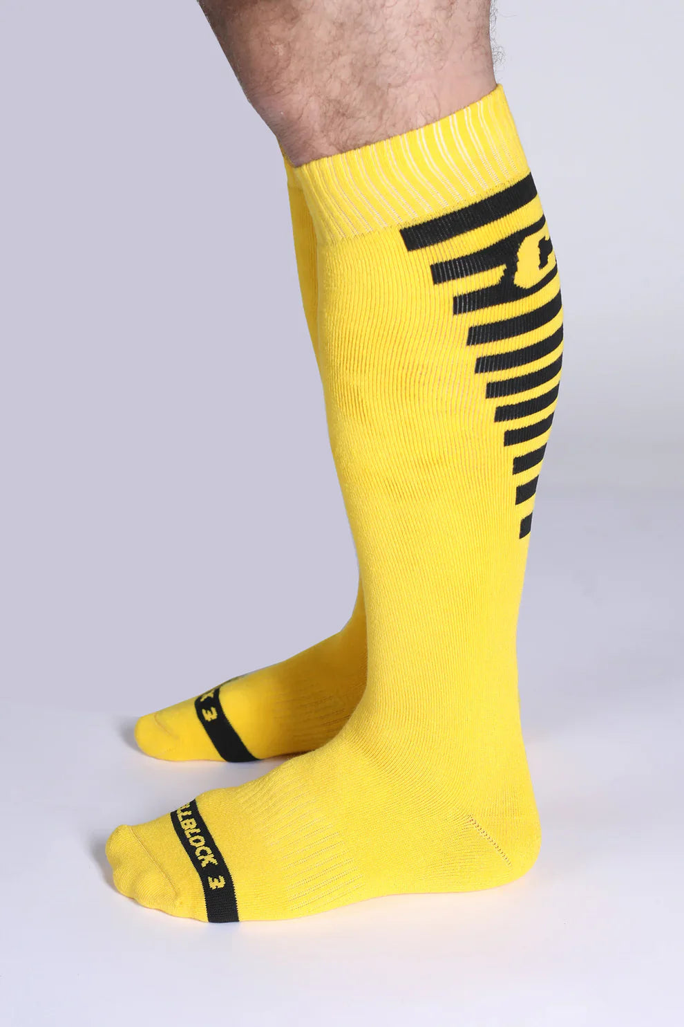 Iron grip knee high socks bright yellow with bold black stripes and reinforced toe caps for durability