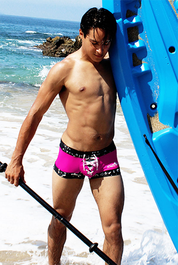 Bright pink icker sea lace up contrast square cut swim trunks with black trim and white skull design fuchsia black
