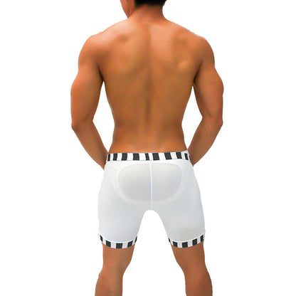 White athletic shorts with black and white candy stripe trim and a padded back panel from icker sea lines
