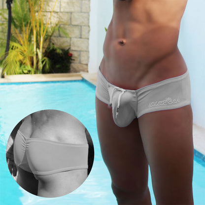 Light gray stretchy fabric laker sea swim trunks with drawstring waistband and embroidered branding for swimwear use
