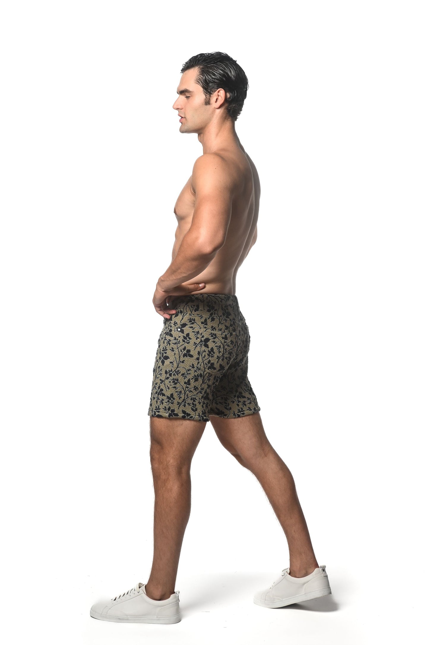 Men’s jacquard printed stretch knit shorts in olive green with a subtle black floral pattern for casual wear