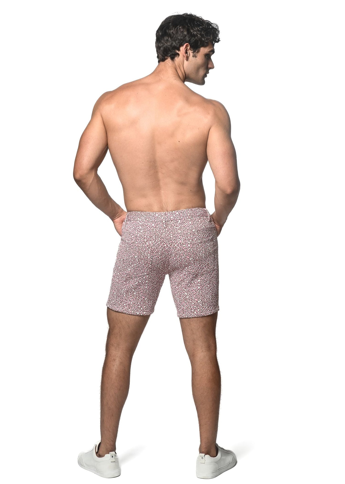 Pink jacquard printed stretch knit shorts with textured speckled fabric showcasing vibrant pattern design