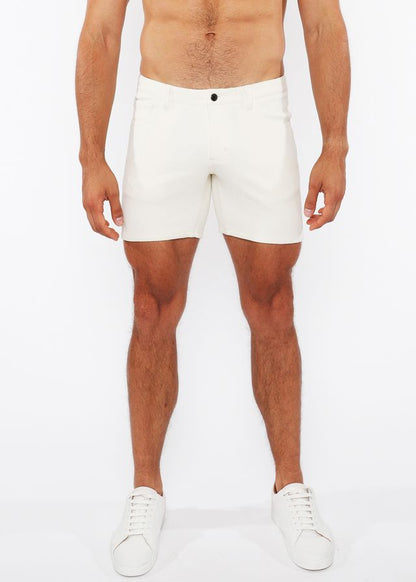 White jaquard stretch knit chino shorts with sleek form-fitting design and black button waistband