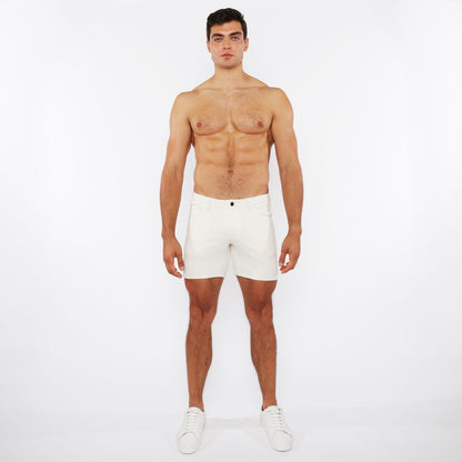 White jaquard stretch knit chino shorts with a sleek minimalist design and a black button at the waistband