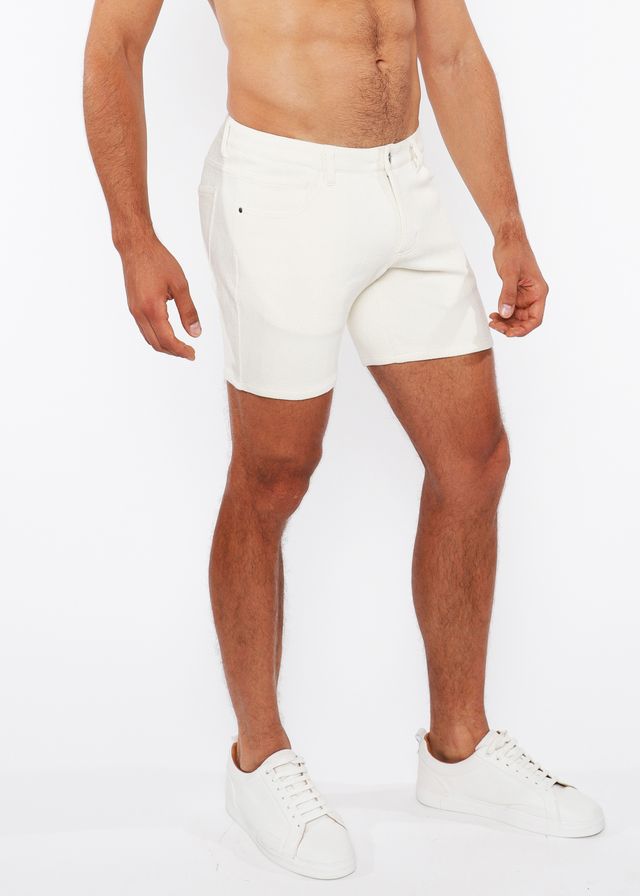 White jaquard stretch knit chino shorts with sleek form-fitting design and subtle stitching details