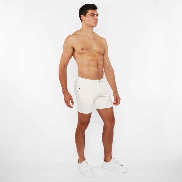 White jaquard stretch knit chino shorts with a clean minimalist design made from breathable athletic fabric
