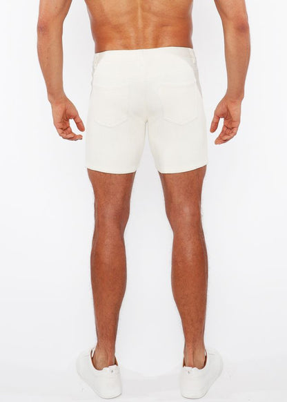 White jaquard stretch knit chino shorts with a sleek form-fitting design and subtle stitching details