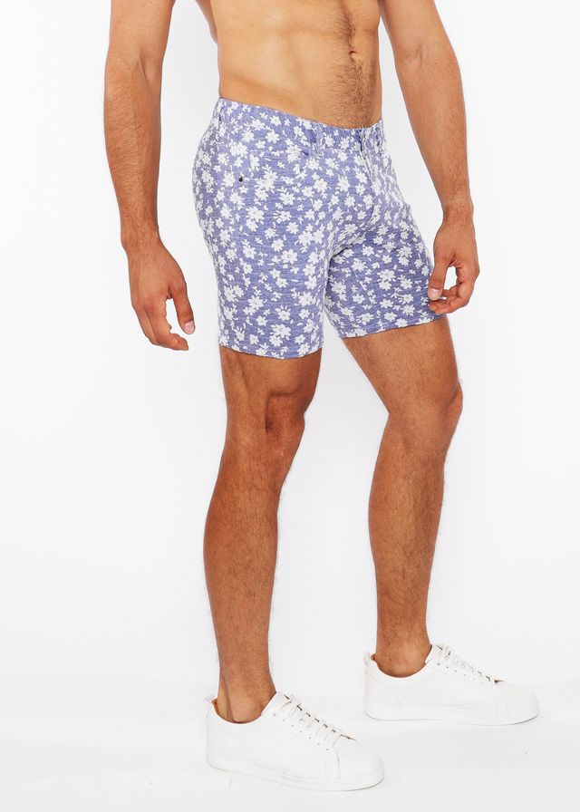 Blue floral patterned jaquard stretch knit shorts with white flowers on light blue fabric