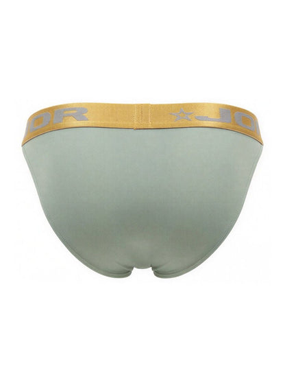 A sleek light green jordan men’s brief with a gold waistband and silver logo from jor 2328 soho bikini collection