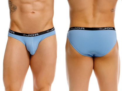 Light blue jor 2346 cannes bikini briefs with black elastic waistband featuring white stars and logo print
