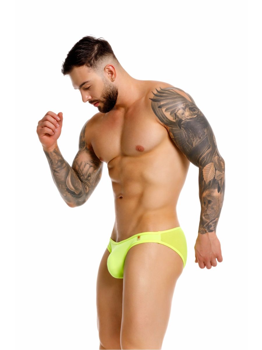 Neon green jor 2353 origin bikini briefs with a small gold logo on the left hipband made for athletic use