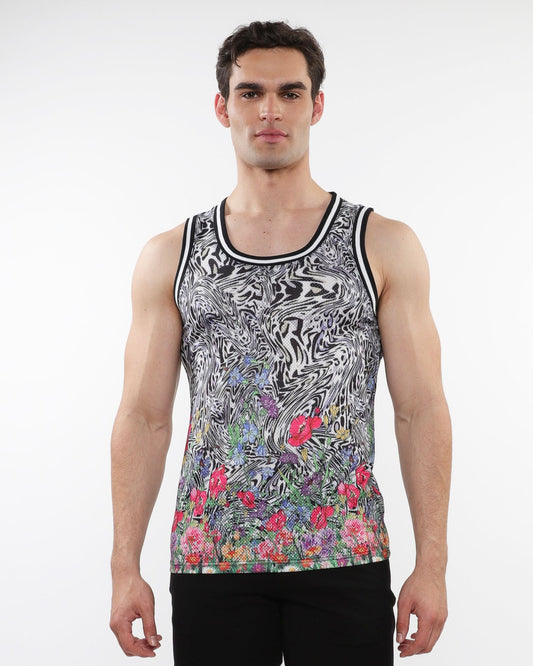Black and white abstract patterned jungle printed mesh tank with stripe ribbing and vibrant floral accents at the hem