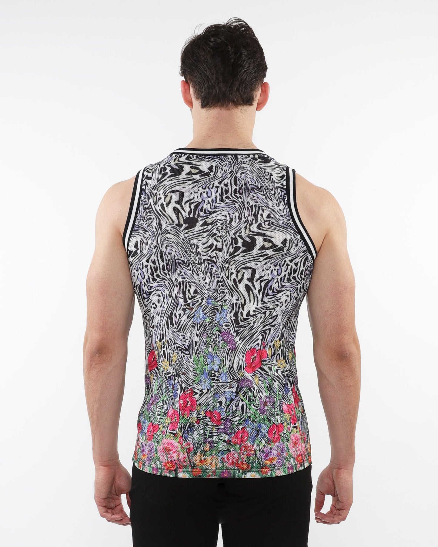 Jungle printed mesh tank with stripe ribbing featuring black and white abstract swirl and colorful floral bottom print