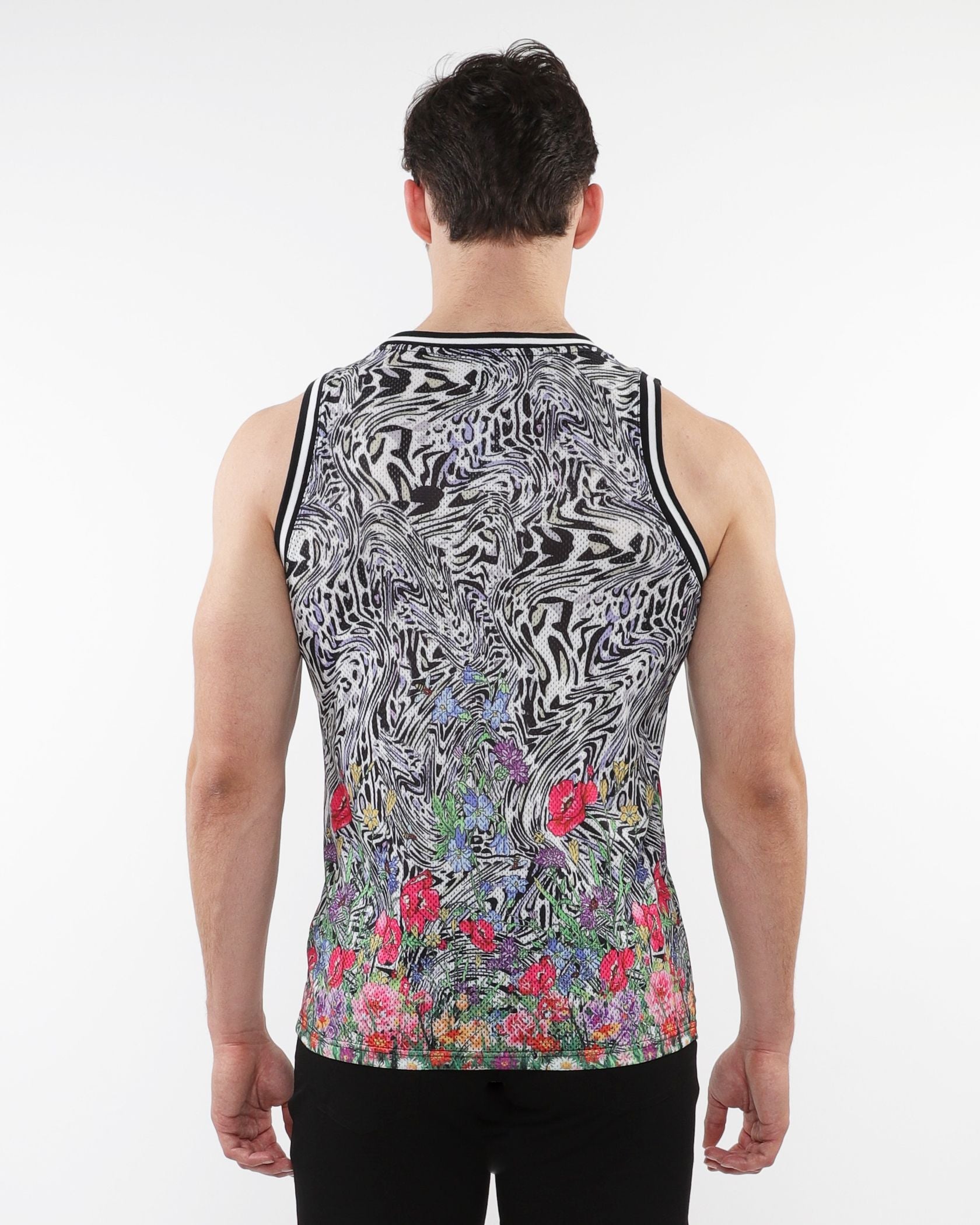 Jungle printed mesh tank with stripe ribbing featuring black and white abstract swirl and colorful floral bottom print
