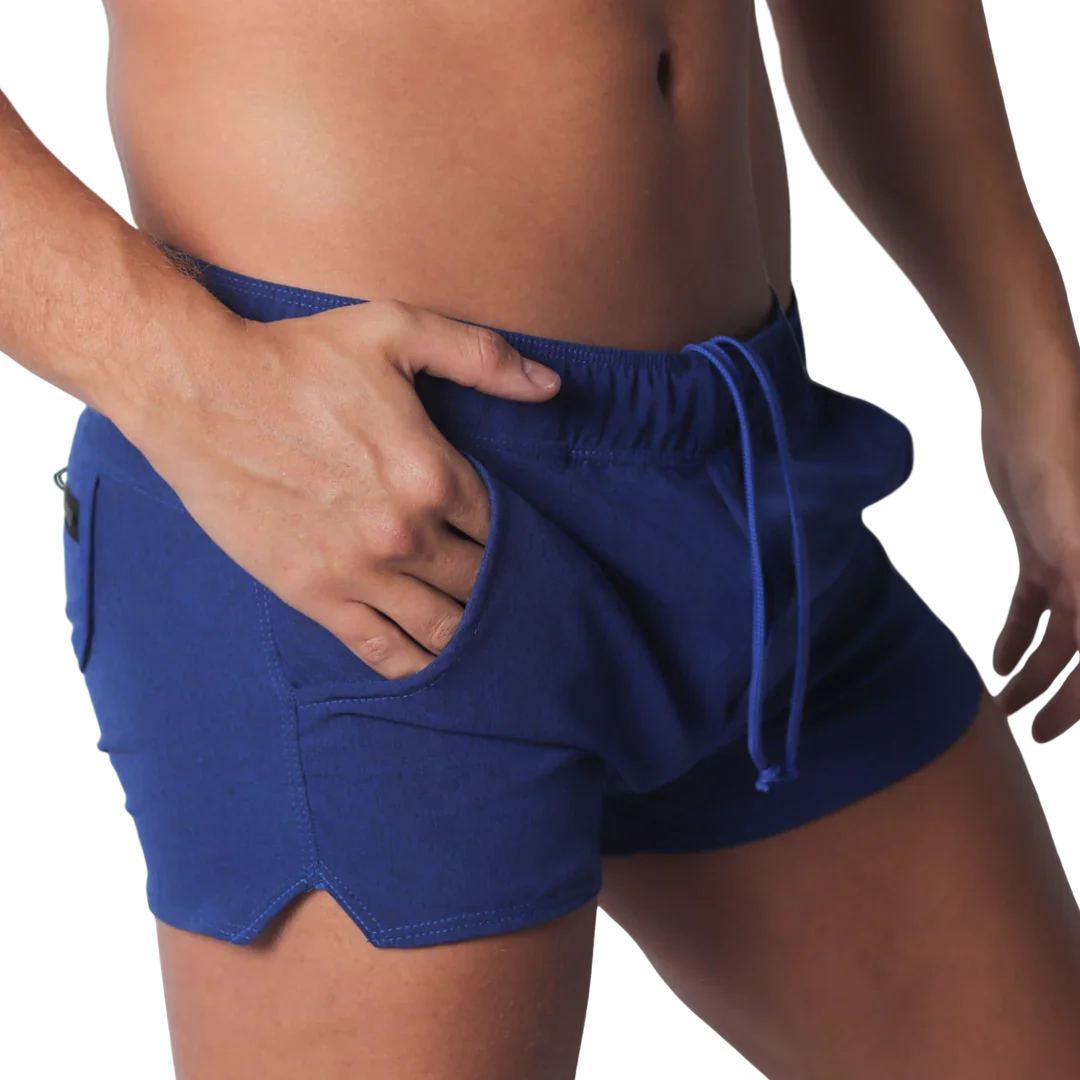 Royal blue fitted athletic shorts with an elastic drawstring waistband, side pockets, and small side leg slits.