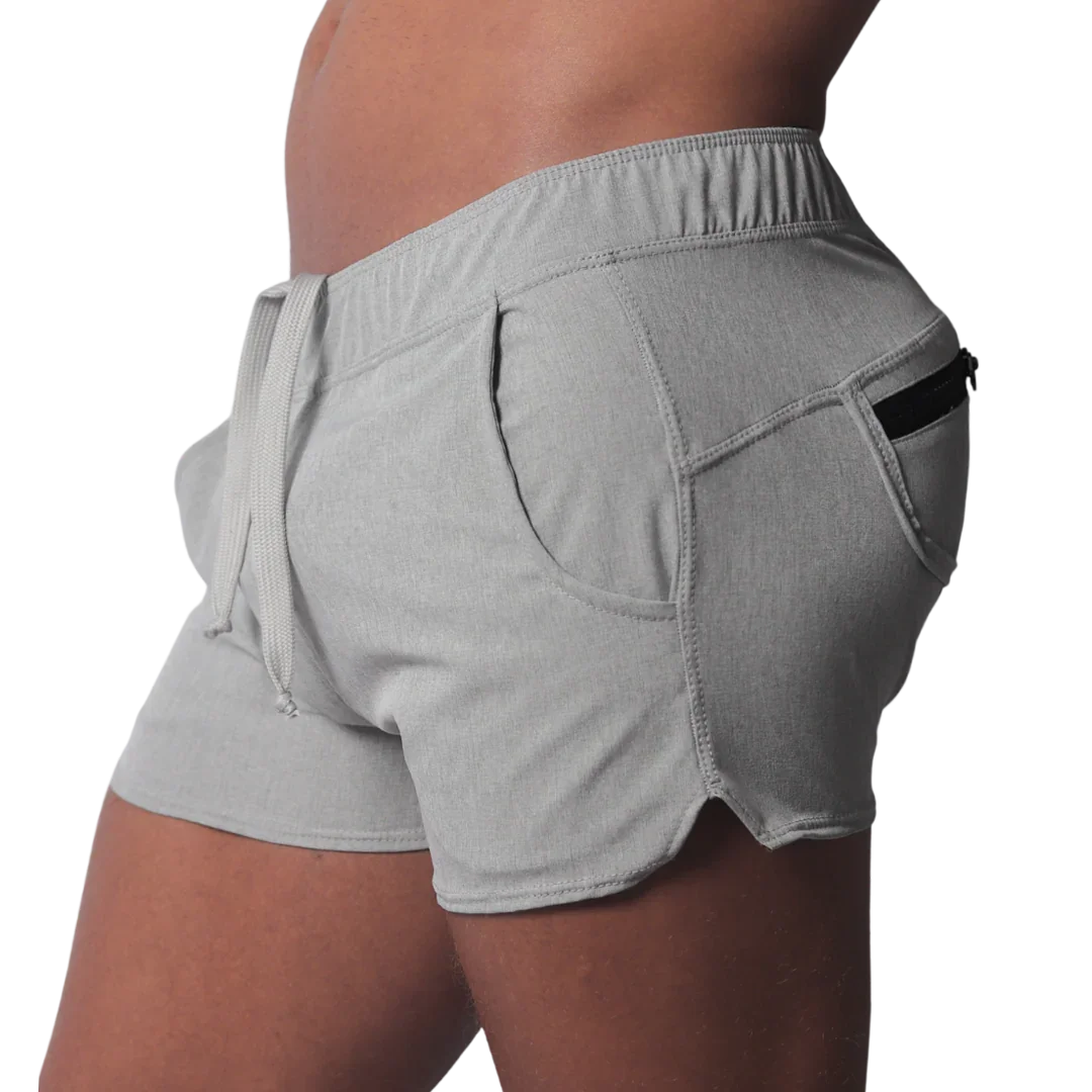 Gray short-length athletic shorts featuring an elastic drawstring waistband and a side pocket with a black zipper.