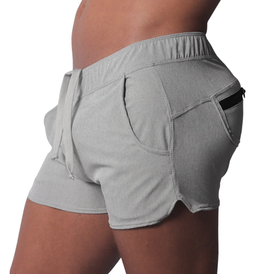Gray short-length athletic shorts featuring an elastic drawstring waistband and a side pocket with a black zipper.
