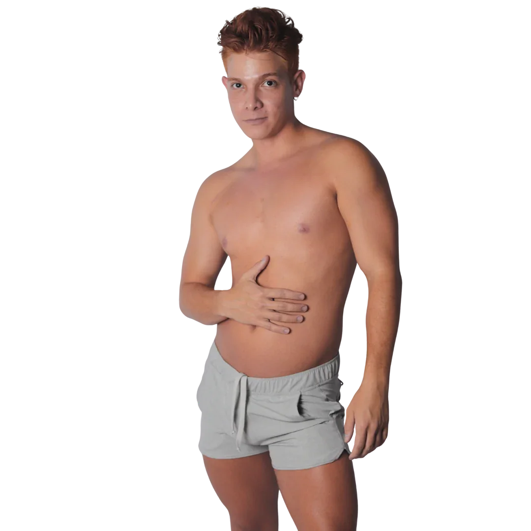 Light gray athletic-style shorts with an elastic drawstring waistband and curved hem, worn by a shirtless man.